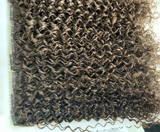 brown curly tape in hair