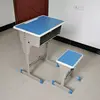 Table et tabouret individuels à un seul pilier.