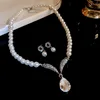 62-piece silver water drop pearl earring and necklace set