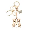 Porte-clés petit papillon doré-M