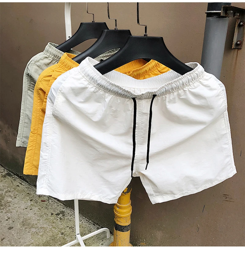 Pantaloncini da surf all'ingrosso Pantaloncini casual da spiaggia da uomo personalizzati Capispalla di moda Costume da surf allentato impermeabile484_voghion.com