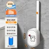 Línea de escobillas de baño con diseño de perro blanco.