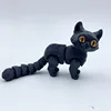 Gato negro de 12 cm de largo.