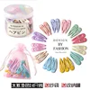 Ice cream colored, 24 pieces, comes with a jar and a mesh bag.