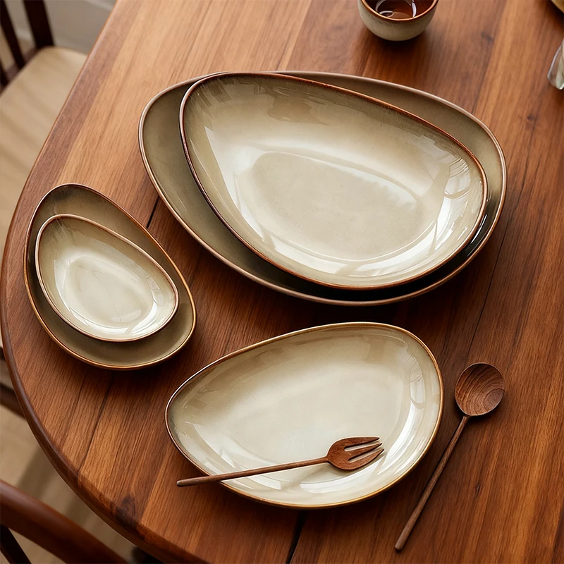 Customized Irregular Organic Pebble Shape Ceramic Dinner Plate Bangkok Brown Reactive Glaze Deep Pasta Salad Plate for Hotel