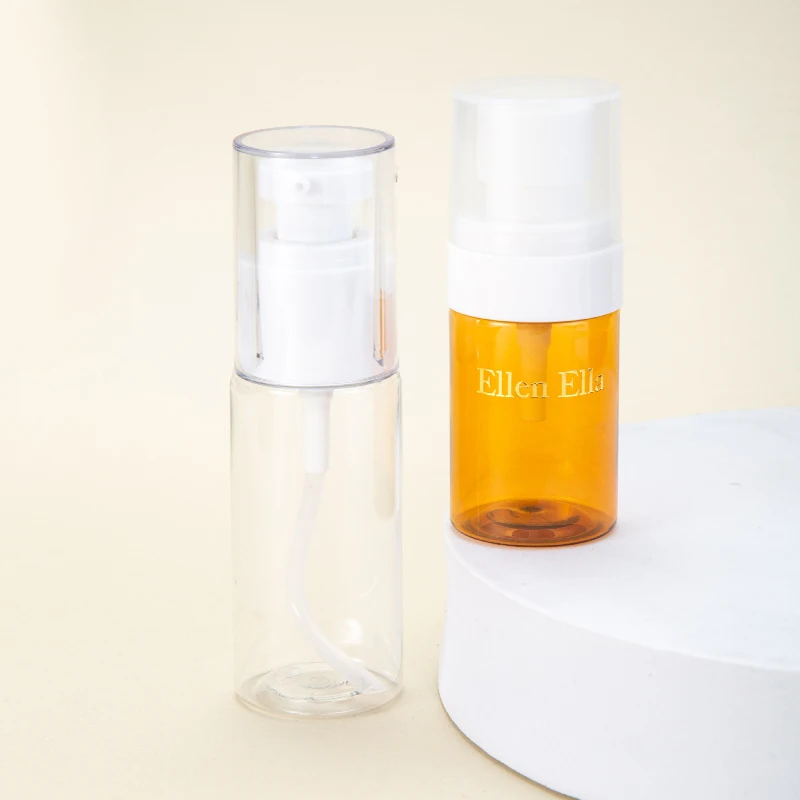 Portable Empty Cylindrical 30ml 60ml Small PET Plastic Bottles Lotion Orange Transparent Cosmetic Pump Bottle manufacture
