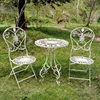 A retro white do old tables and chairs-table and two chairs