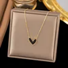 Collana in acciaio inossidabile a forma di cuore con olio nero gocciolante