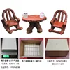 Two rocking chairs, coffee cups, and a table box