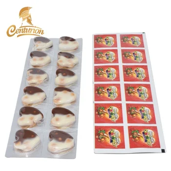 Mini cartoon cookiess with chocolate sweet candy in small heart shape tray