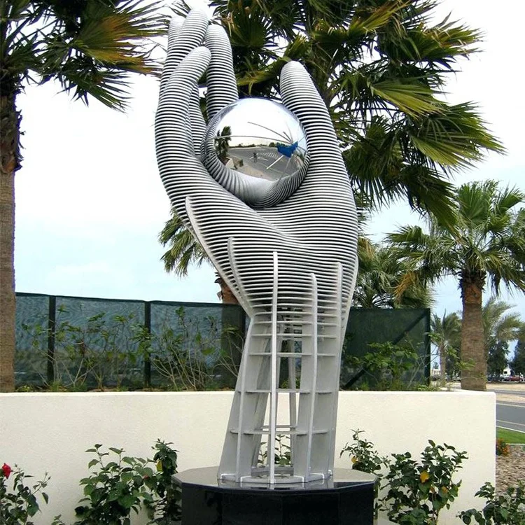 abstract hand hold a ball statue