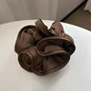 Marrón oscuro (con coletero de madera en forma de oreja)