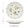Assiette à bordure ajourée à motif citron de 11 pouces
