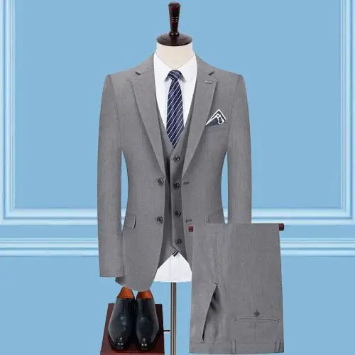 Suit jacket, pants, blue shirt and derby shoes in black leather on grey  background. Overhead view of classic elegant formal men's outfit. Set of  stylish men's clothes. Flat lay, top view. Stock