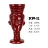 Witch statue red