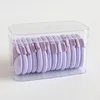 1 tableta - redonda de color violeta claro