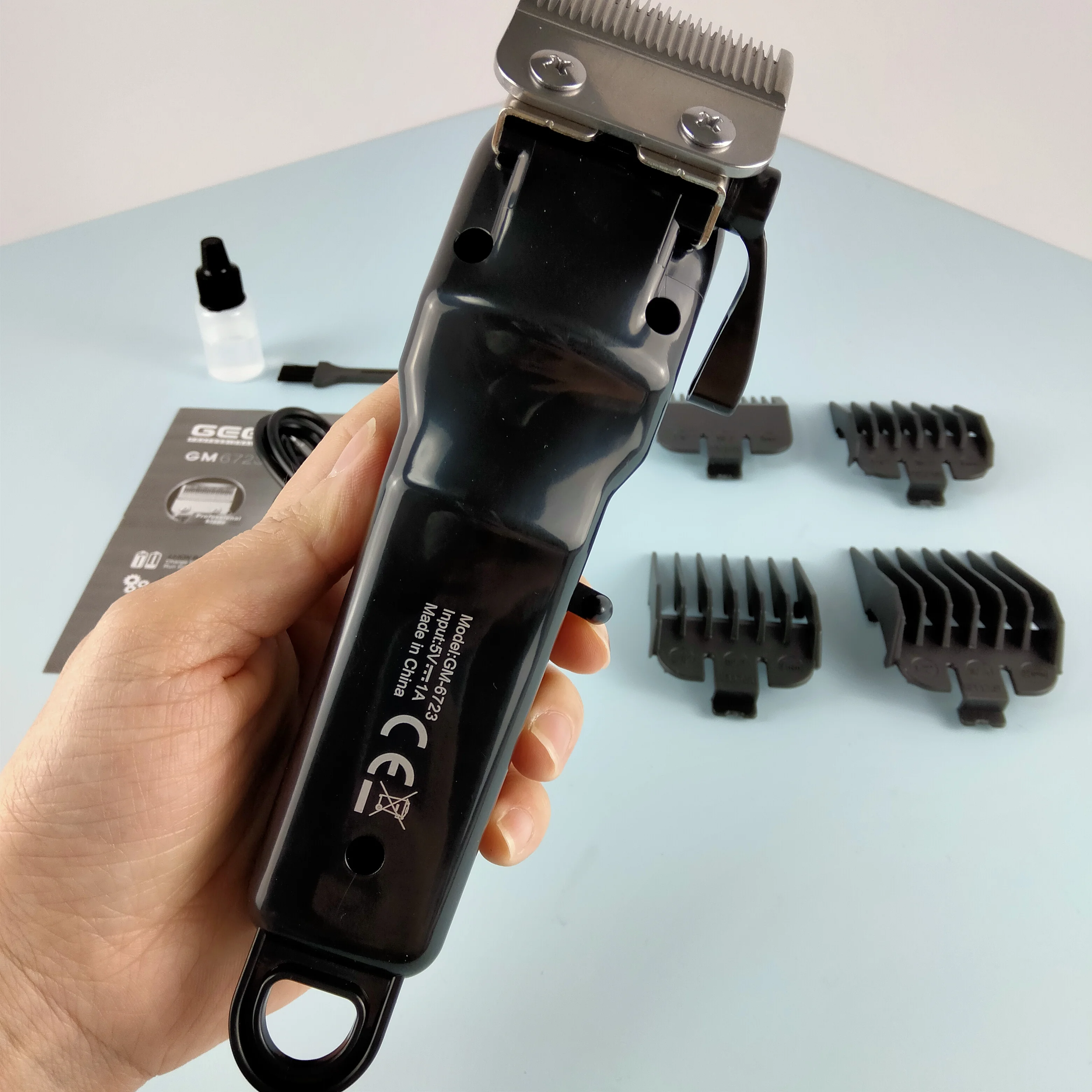 View Larger Image Geemy GM-6723  Barber Equipment Professional Cordless Electric Hair Trimmer Rechargeable Hair Clip