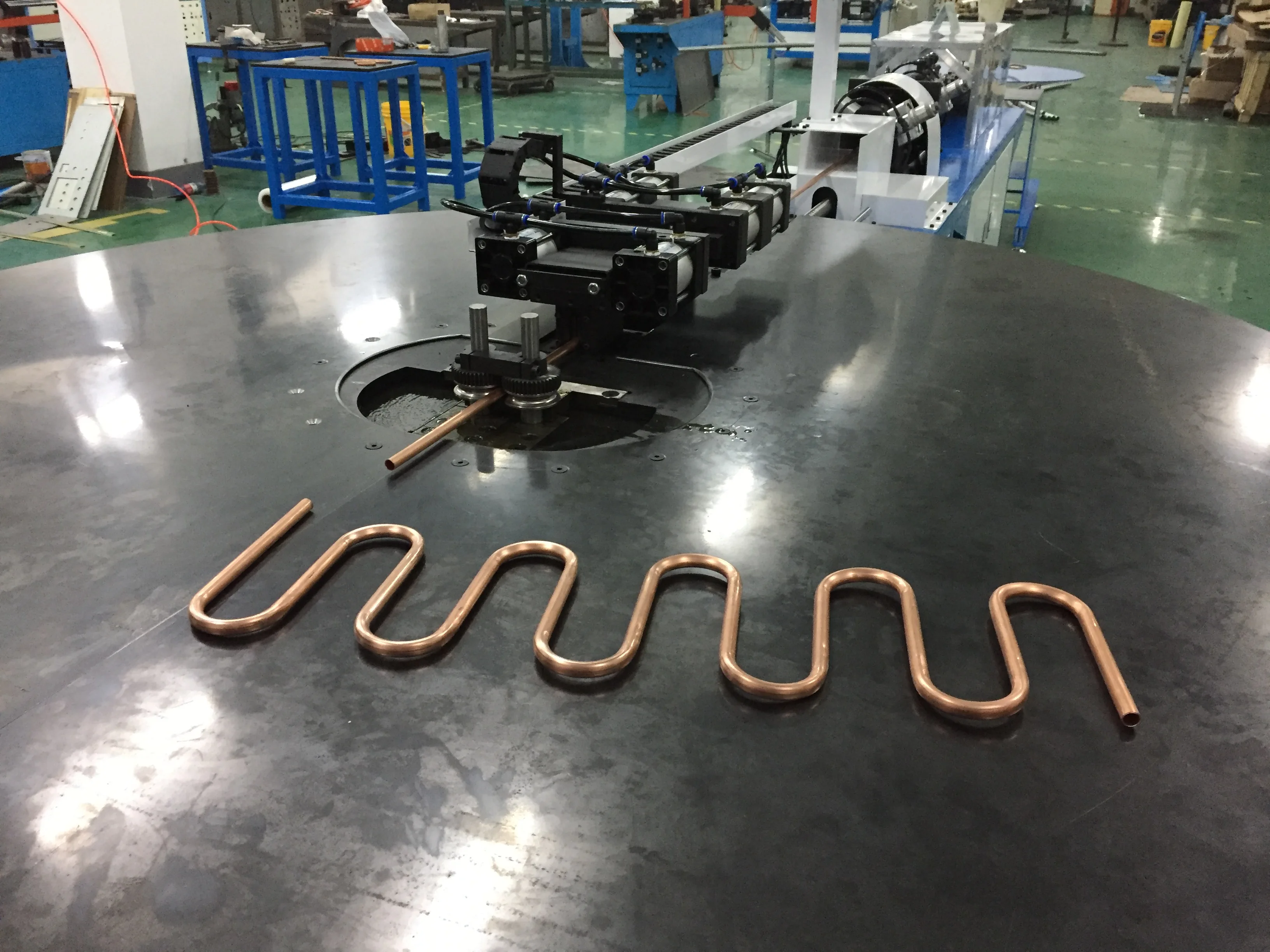 BOBO Machine automatic pipe tube straightening bending serpentine and cutting shown in a detail photo for this news article
