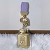 Perfume bottle (containing 20mg of gold - purple rope)