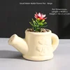 Maceta pequeña con regadera-beige