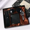 Set regalo nero da 5 pezzi: portafoglio, occhiali da sole, cintura, orologio
