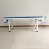 Lit électrique pour changement de draps et lit d'examen