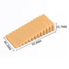 Small orange triangular door stop