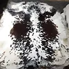 Clean white base with large black patches on sides