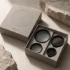 Warm stone grey with precise lens-ring graphics