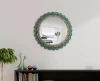 Teal blue and floral patterned wall mirror