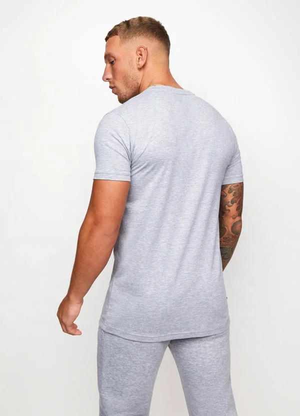 Venta al por mayor de algodón ropa deportiva camiseta conjunto de