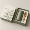 Warm ivory with muted sage green panels and fine gold leaf artwork
