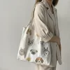 Bolso blanco lechoso con ilustración de perro.