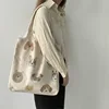Bolso beige con ilustración de perro