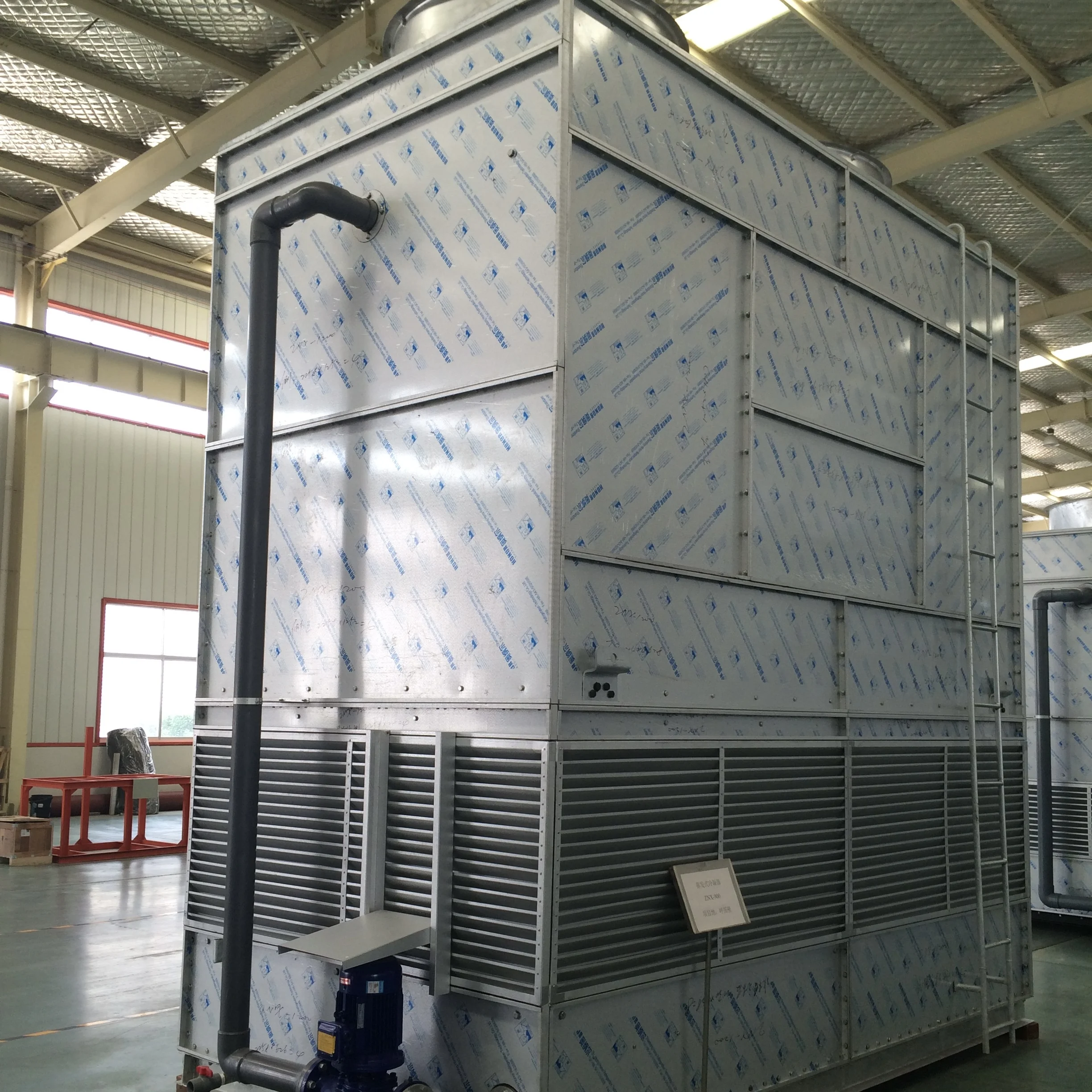 Evaporative condensers for industrial refrigeration and meat processing plants