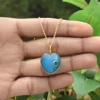 1.Oeil de chat bleu avec CZ émeraude verte
