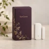 Aubergine carton with ivory side panel and courtyard vine engraving