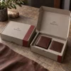 Stone gray and oxblood with leather-grain-inspired line art