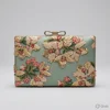 Soft sage green / muted teal-grey