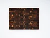 Warm golden-brown acacia with dark reddish-brown mahogany mosaic