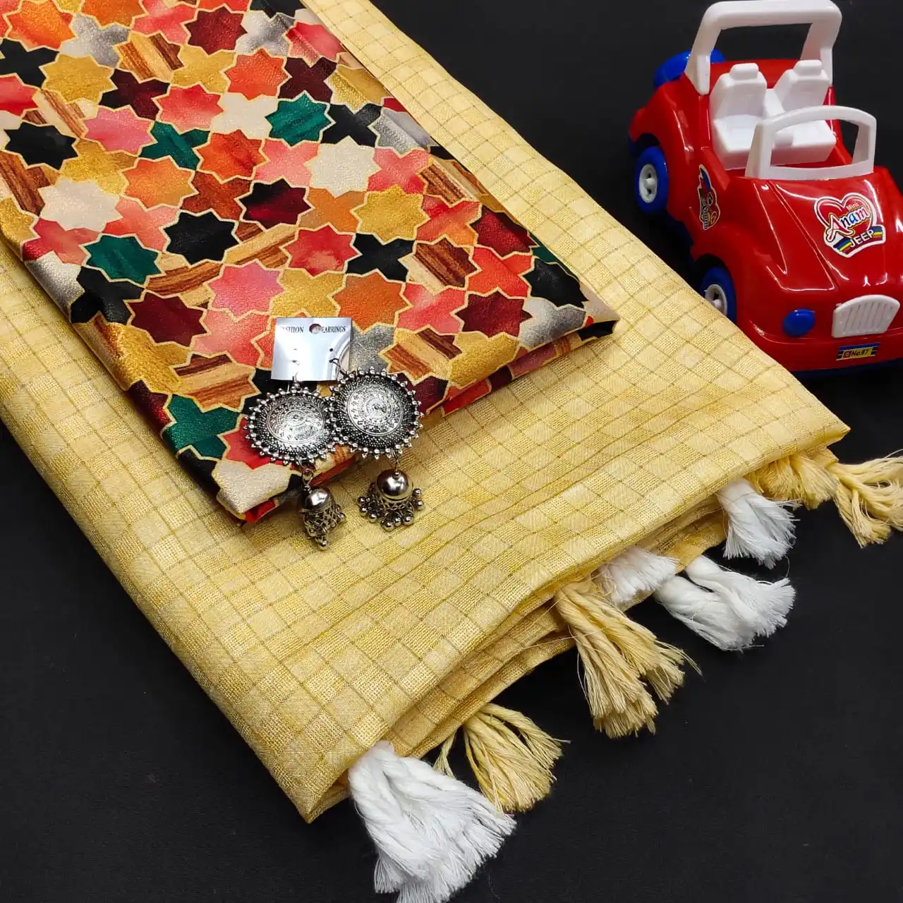 Mesmerising  Jute Silk Self Chex Saree with Cotton Tussels Gota Satin Silk Digital Printed Blouse and with Free Ornaments