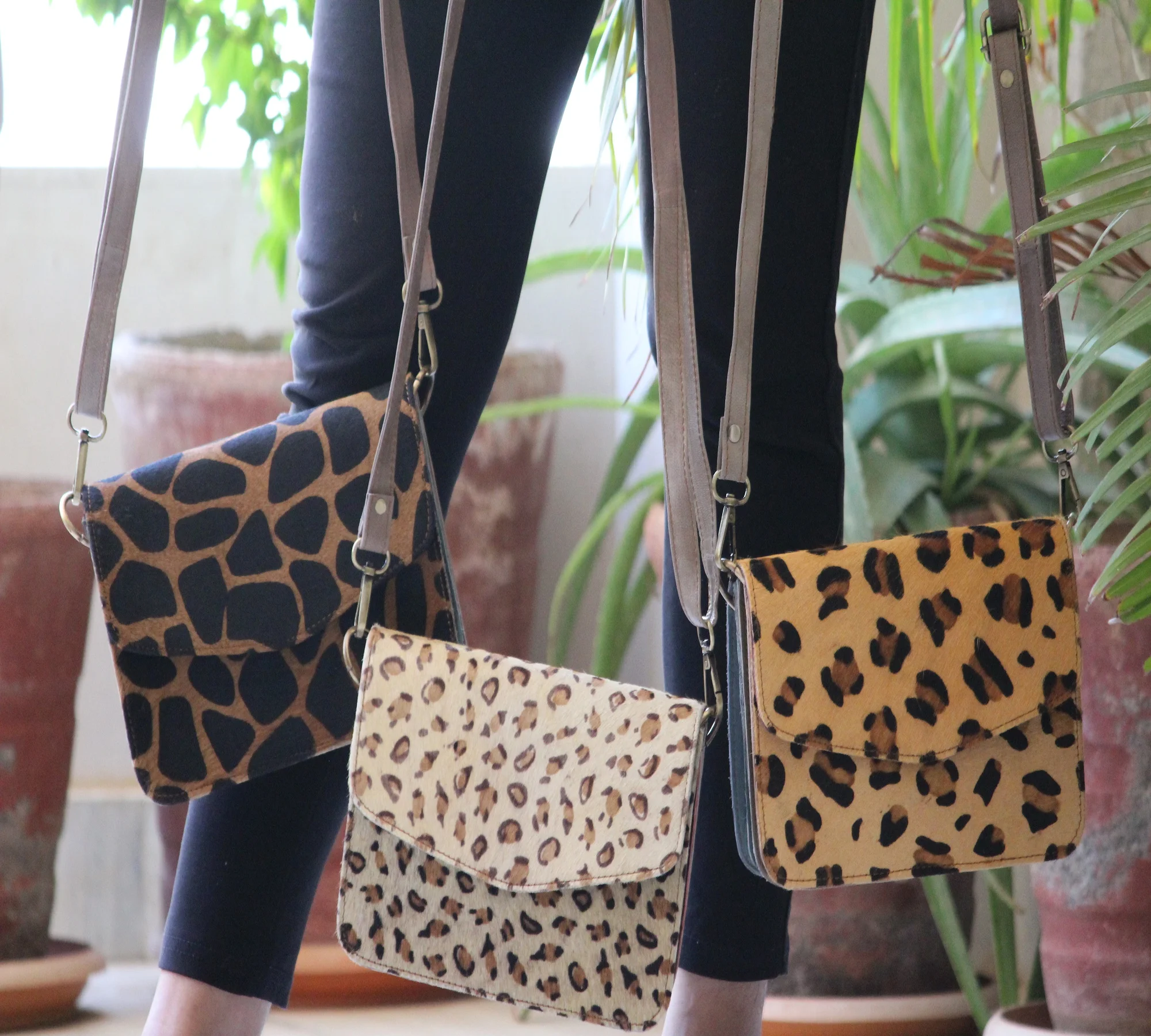animal print sling bolsa
