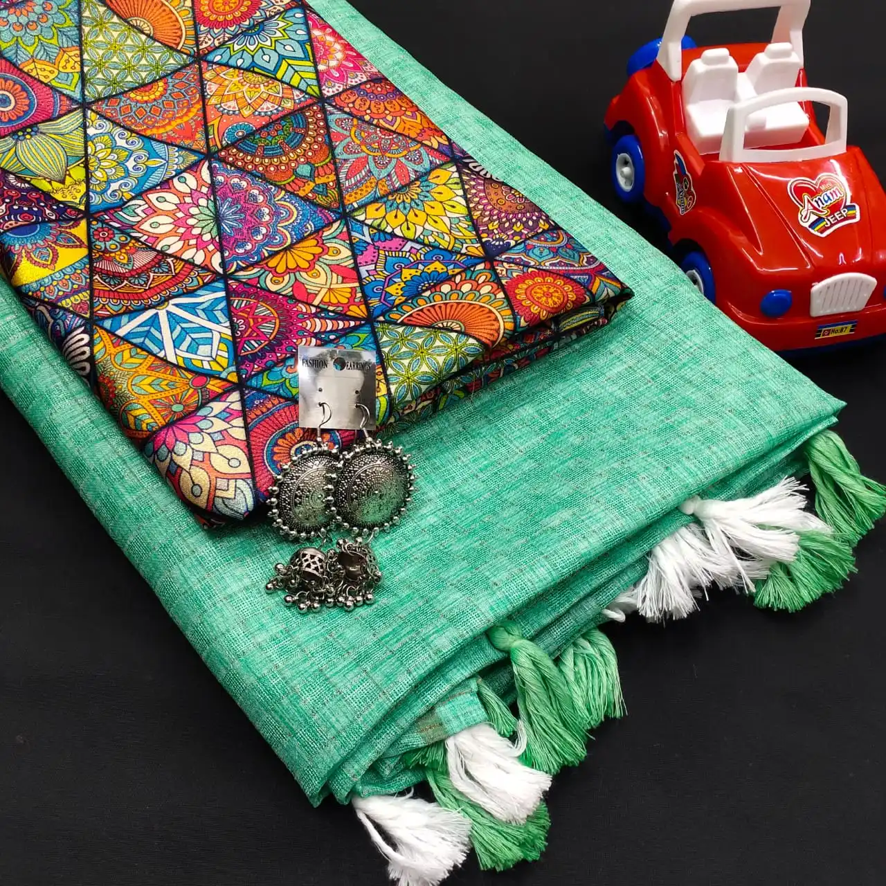 Mesmerising  Jute Silk Self Chex Saree with Cotton Tussels Gota Satin Silk Digital Printed Blouse and with Free Ornaments