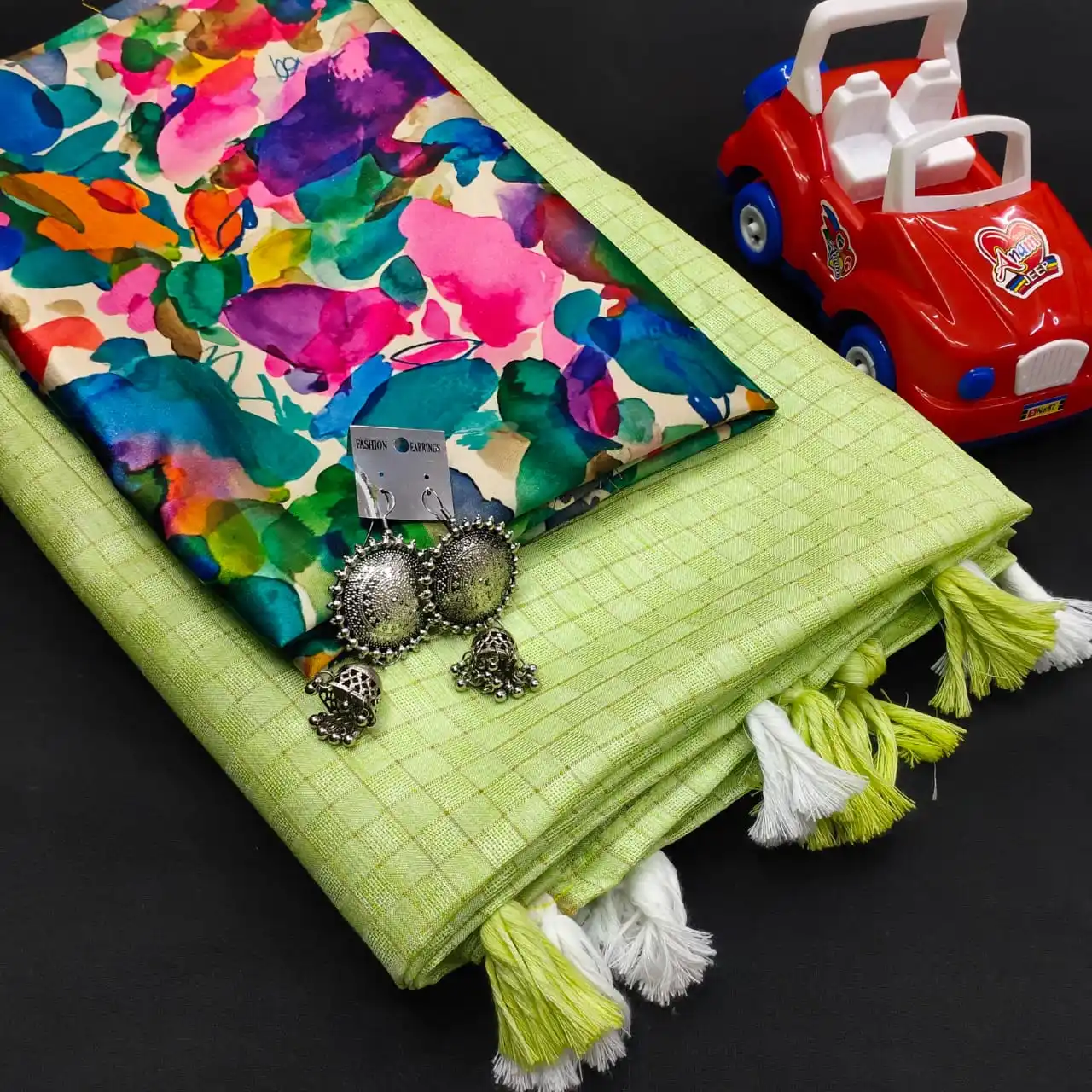 Mesmerising  Jute Silk Self Chex Saree with Cotton Tussels Gota Satin Silk Digital Printed Blouse and with Free Ornaments