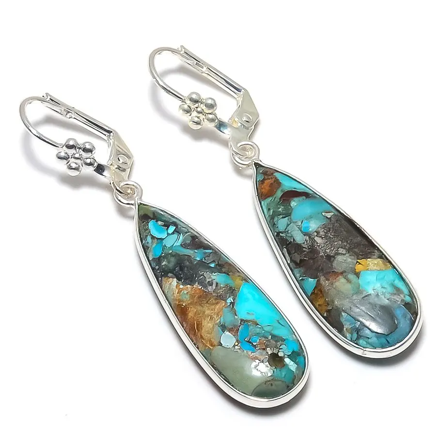Silver plated copper earrings and blue crystals.