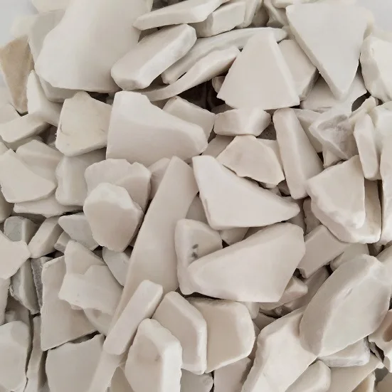 washed rigid PVC regrind scraps from recycled white PVC pipes and fittings