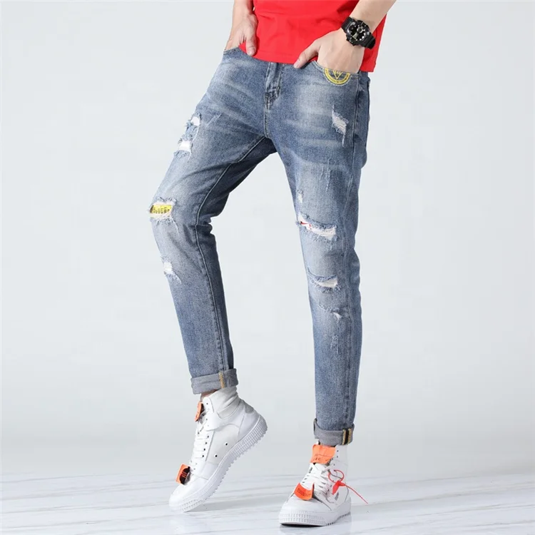 white cut up jeans for men